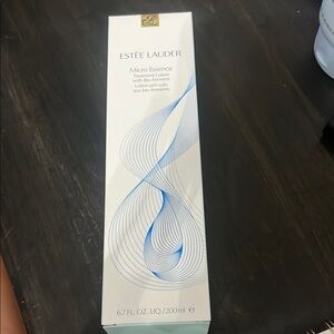 Estee Lauder Micro Essence with Blue and Gold Accents